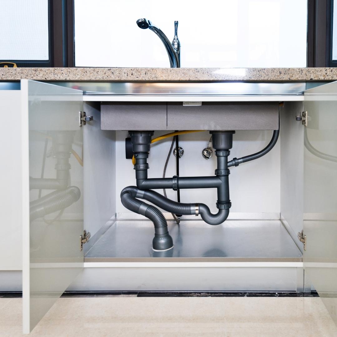 Water pipes under sink